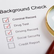magnifying glass over background check form