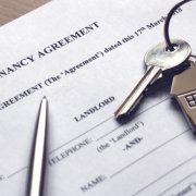 signing a tenancy agreement to receive keys to house